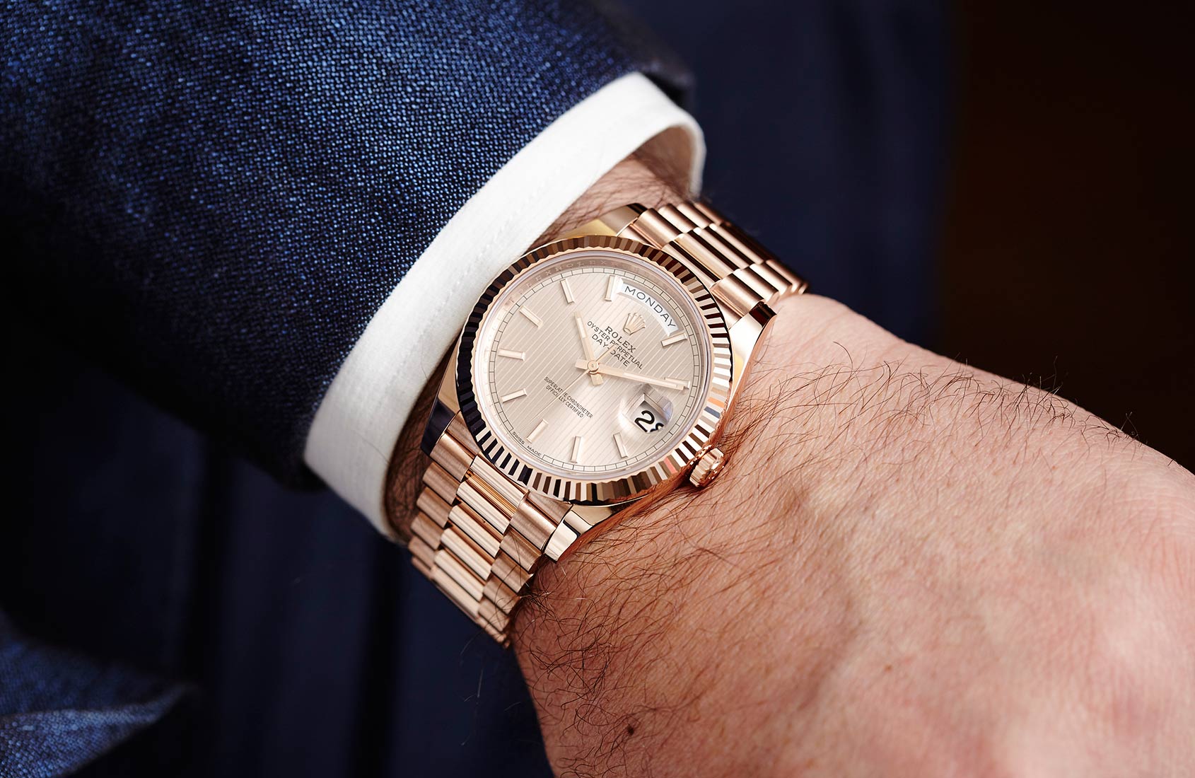 rolex day date gold on wrist