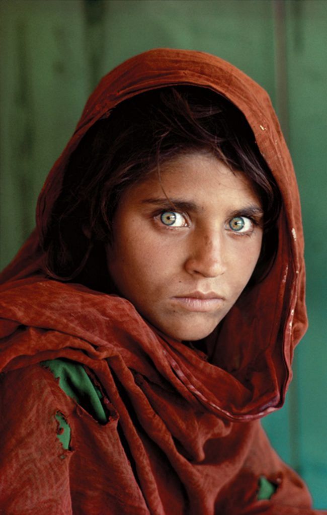 Afghan Girl, at Nasir Bagh refugee camp near Peshawar, Pakistan 1984 The green-eyed Afghan girl became a symbol in the late twentieth century of strength in the face of hardship. Her tattered robe and dirt-smudged face have summoned compassion from around the world; and her beauty has been unforgettable. The clear, strong green of her eyes encouraged a bridge between her world and the West. And likely more than any other image, hers has served as an international emblem for a difficult era and a troubled nation.