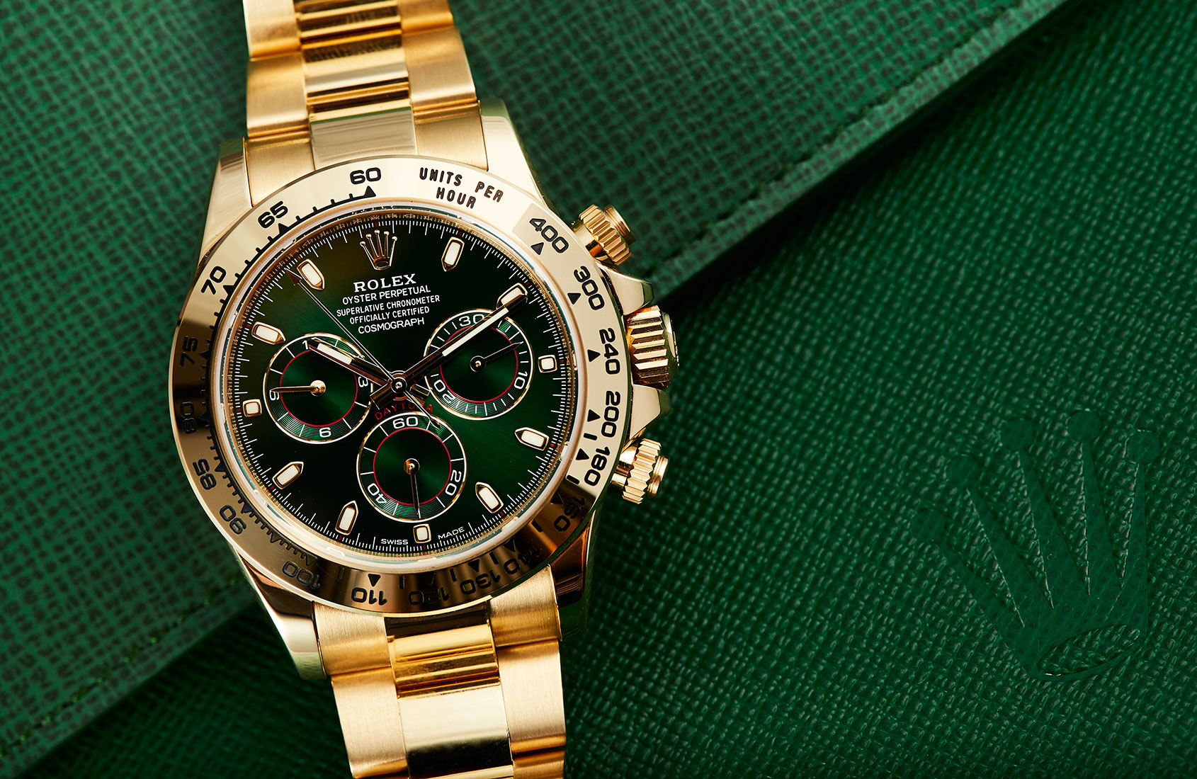 gold daytona with green face