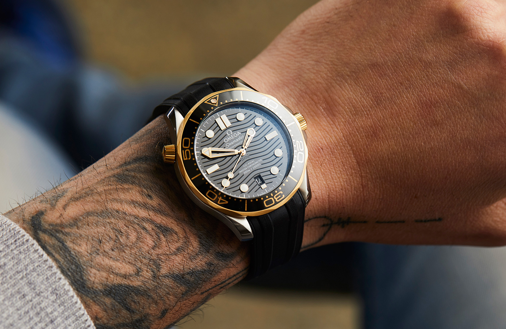 omega black and gold watch