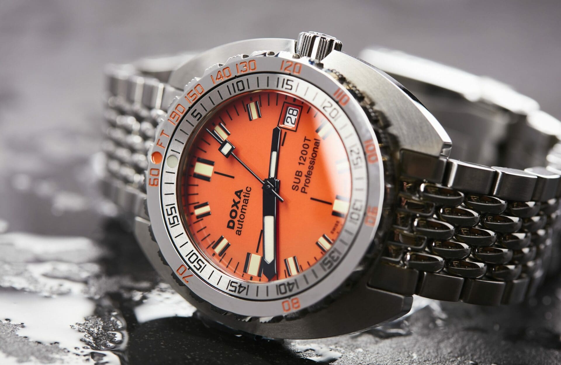 EVERY WATCH TELLS A STORY: Andrew’s DOXA SUB 1200T and the William Wood Valiant Red Watch face off on each wrist
