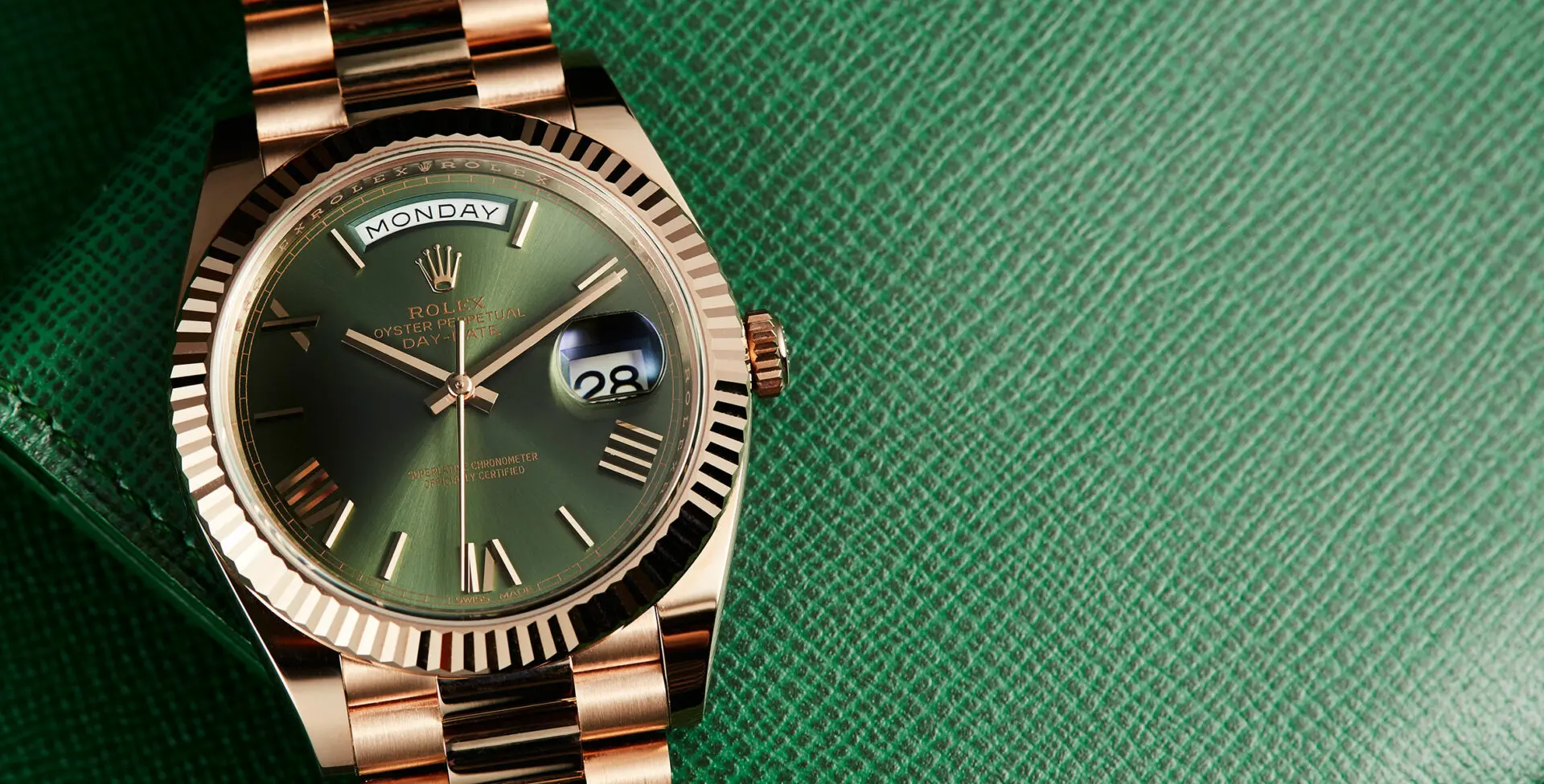 Rolex gold discount green day date