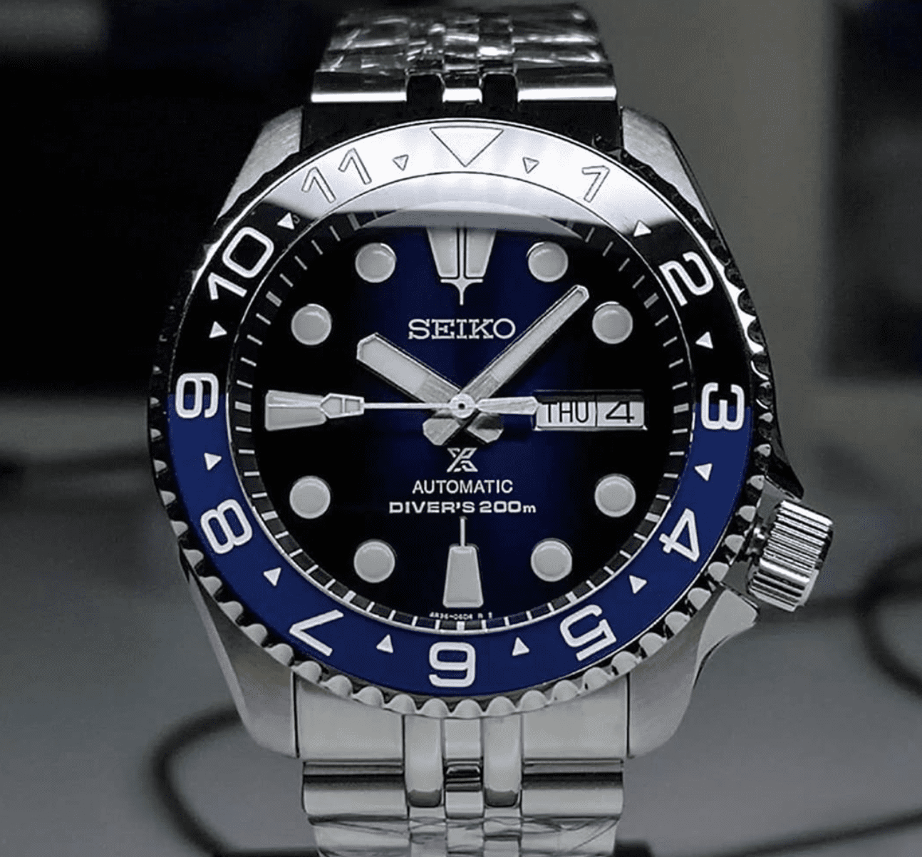 Seiko Mod Wrist Watch With A Blue Dial, White Markers And Red Accents,  Homage To Rolex Submariner Or Omega Seamaster Stock Photo Alamy |  