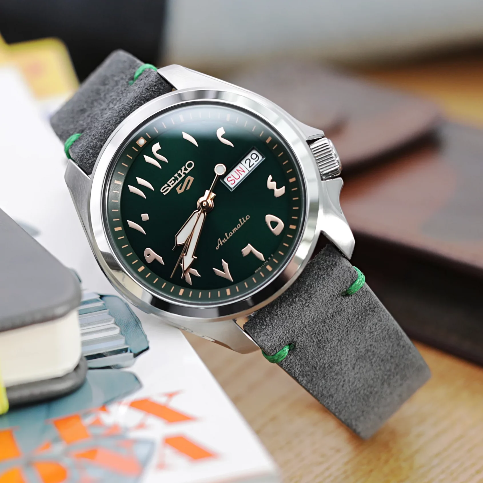 green dial watch pair