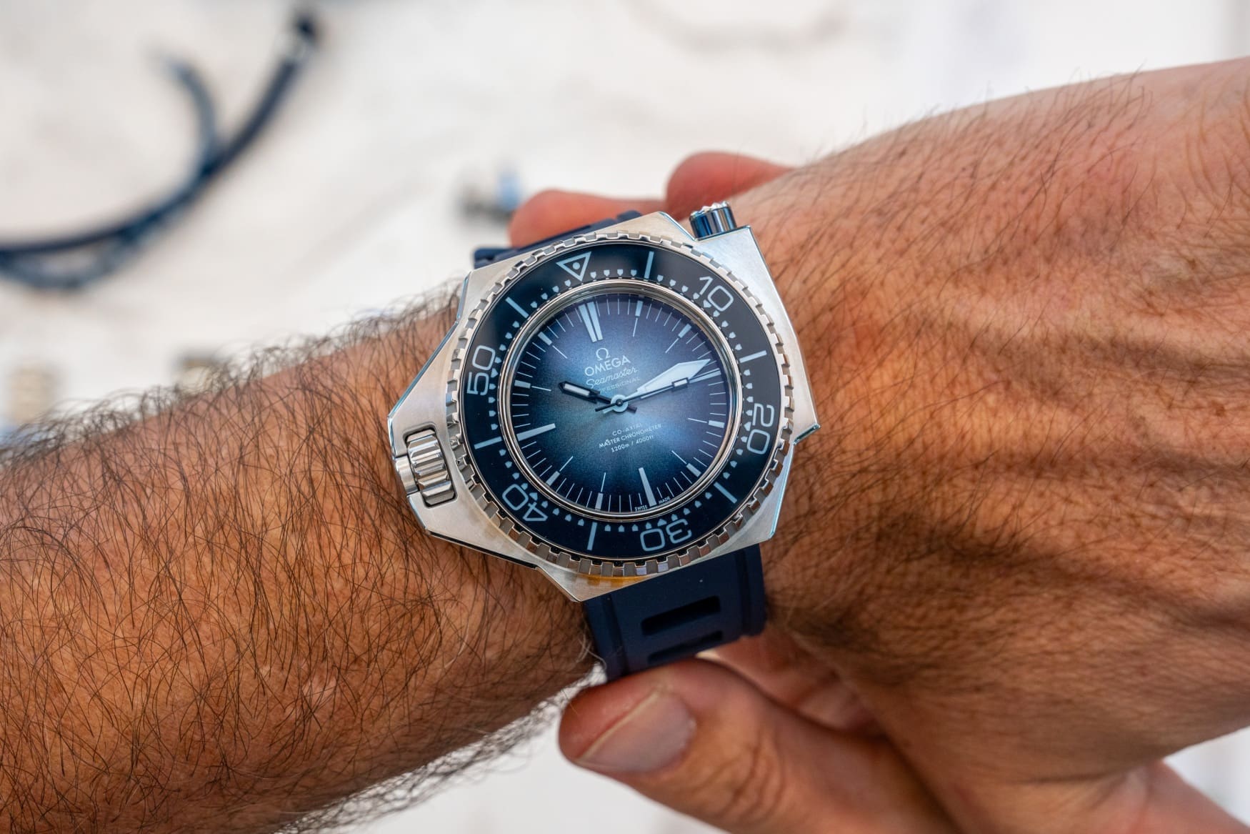omega seamaster ploprof 1200m summer blue wrist
