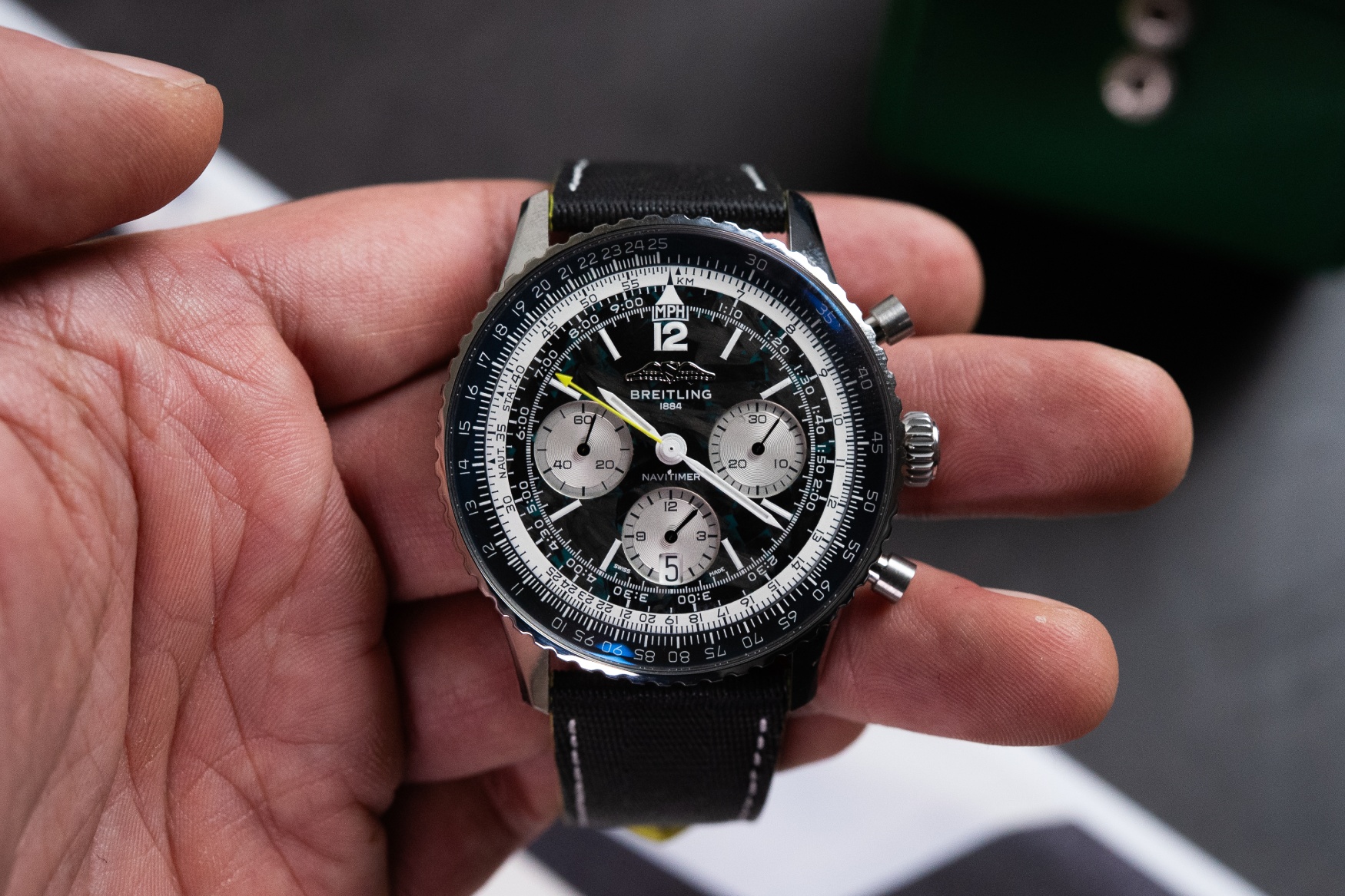 Breitling Navitimer B01 Chronograph 43 Aston Martin Aramco Formula One Team in hand